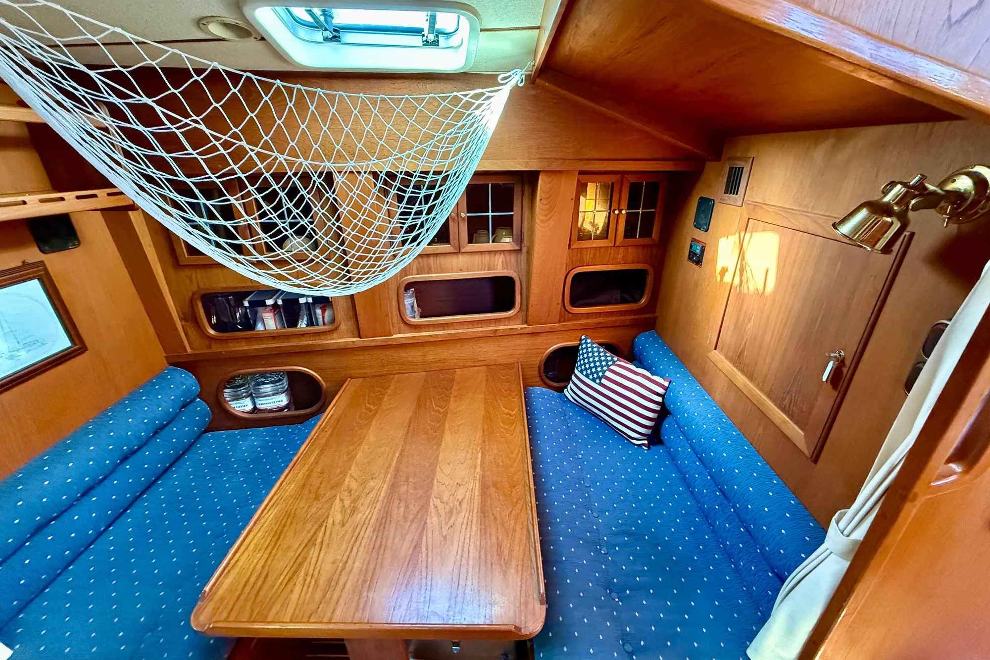 Dinette directly across from galley. Have a drink and keep the chef company!