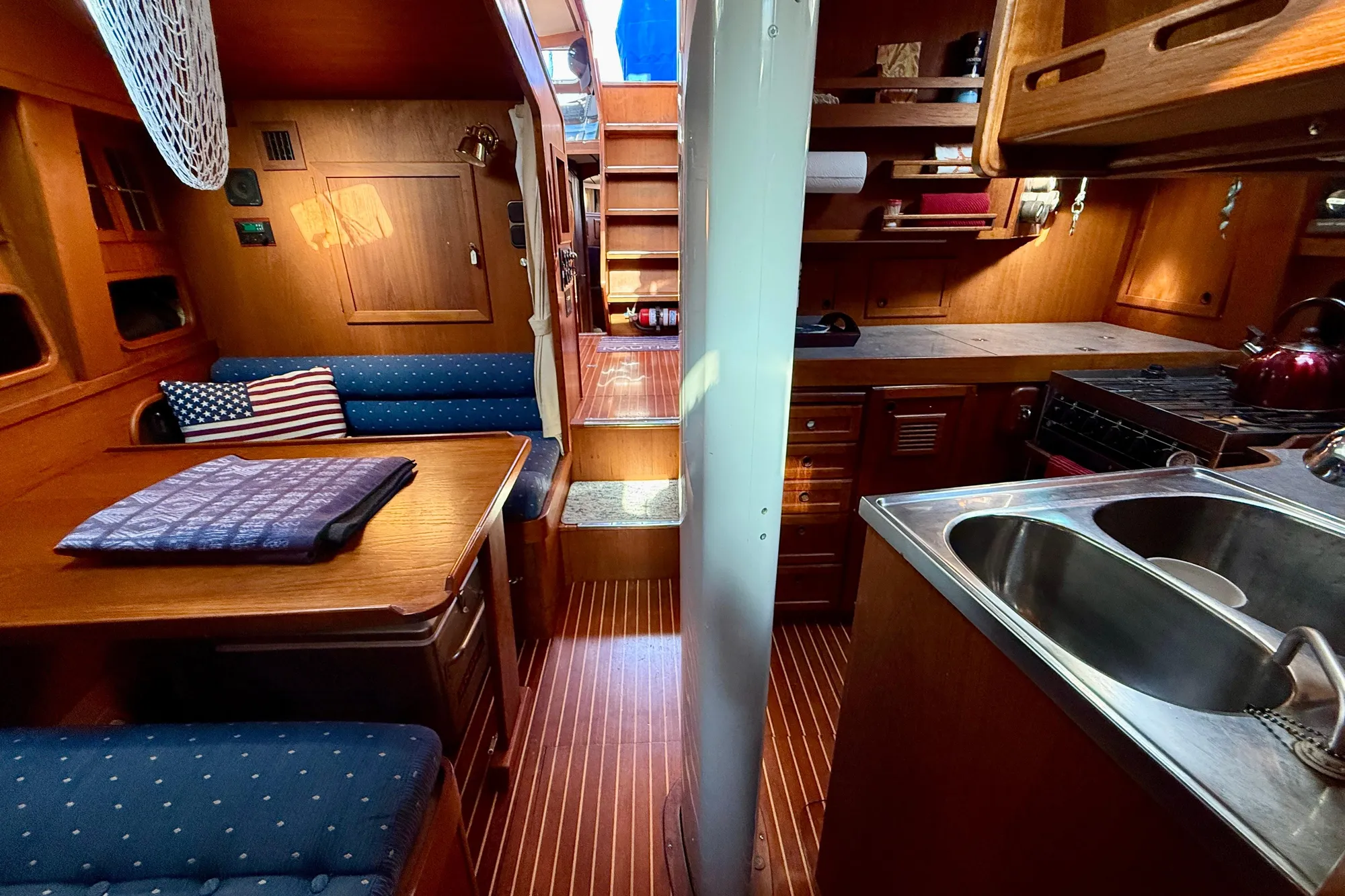 Galley to port with dinette to starboard a few steps down from pilothouse
