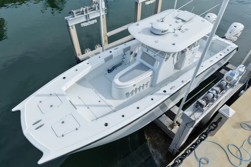  Yacht Photos Pics 2022 Freeman 34VH boat docked, showcasing sleek design and dual outboard motors.