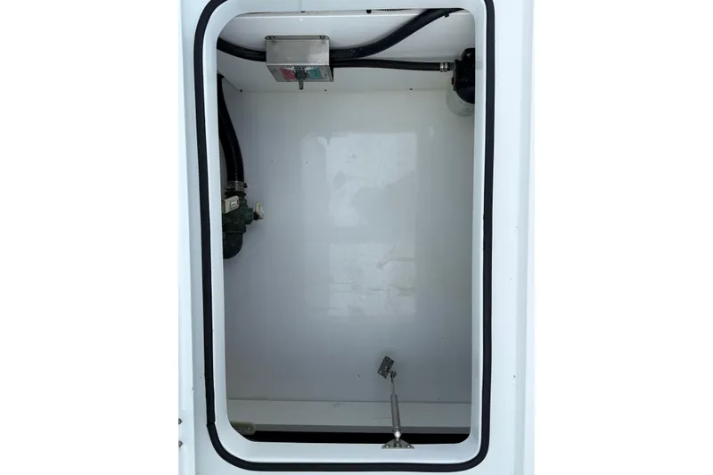  Yacht Photos Pics Freeman 34VH 2022 boat compartment with hoses and fittings.