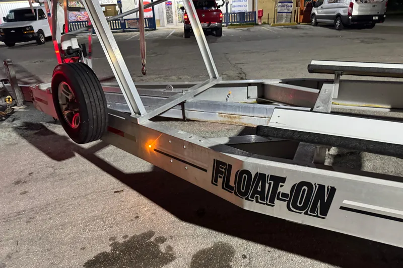  Yacht Photos Pics Trailer with "FLOAT-ON" branding, Freeman 34VH model, 2022, parked in a lot at night.