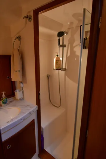 Promesa Yacht Photos Pics Compact bathroom shower in 2021 Hylas M44 yacht, featuring modern fixtures and amenities.