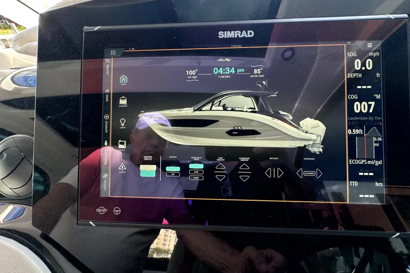 Jet Privé Yacht Photos Pics Simrad display showing 2021 Sea Ray Sundancer 370 Outboard boat controls and data.