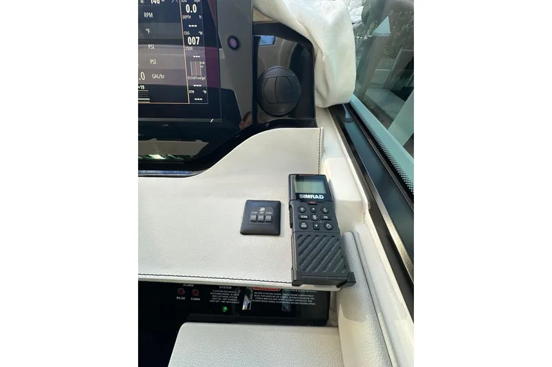 Jet Privé Yacht Photos Pics Simrad marine control panel on 2021 Sea Ray Sundancer 370 Outboard dashboard.