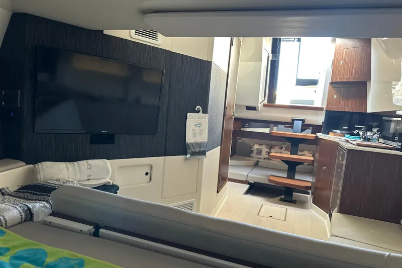 Jet Privé Yacht Photos Pics Interior of 2021 Searay 370ob boat with modern kitchen and entertainment area.