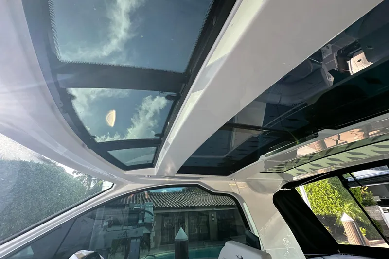 Jet Privé Yacht Photos Pics 2021 Searay 370ob boat interior with panoramic glass roof and modern design.