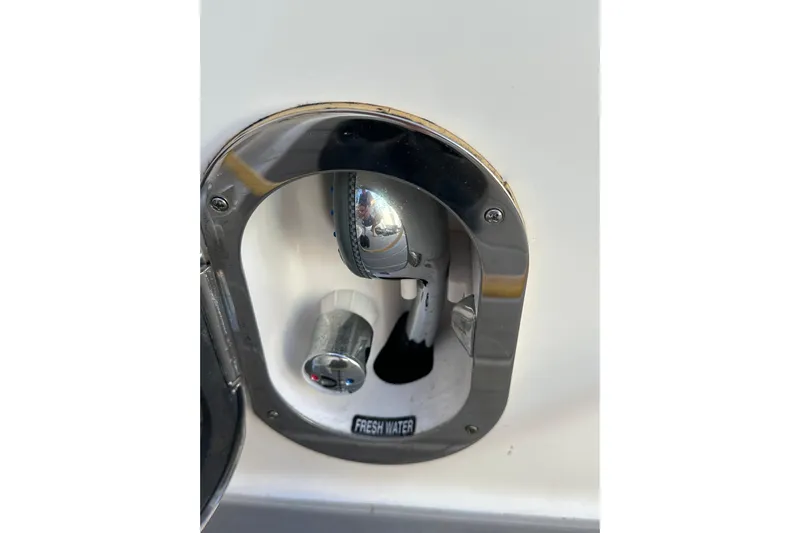 Jet Privé Yacht Photos Pics Freshwater outlet on 2021 Searay 370ob boat, featuring chrome finish.