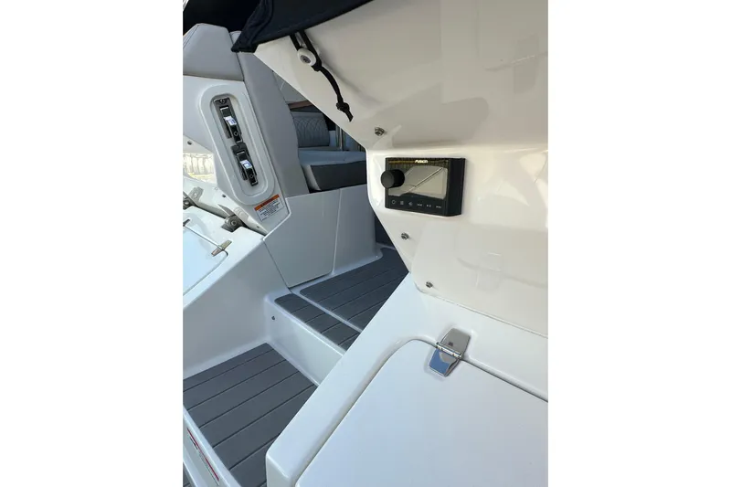 Jet Privé Yacht Photos Pics 2021 Searay 370ob boat interior with control panel and seating area.