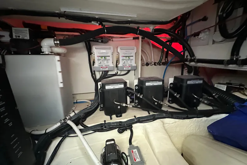 Jet Privé Yacht Photos Pics Engine compartment of 2021 Searay 370ob boat, showcasing wiring and control systems.