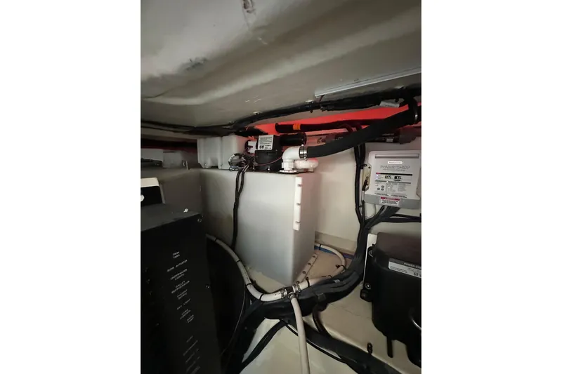 Jet Privé Yacht Photos Pics Engine compartment of 2021 Searay 370ob boat, showcasing wiring and components.