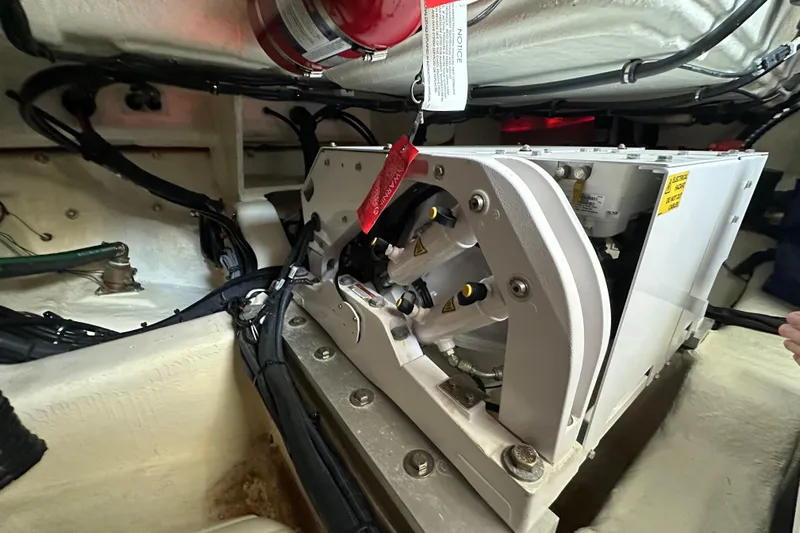 Jet Privé Yacht Photos Pics Engine compartment of 2021 Searay 370ob boat, featuring mechanical components and wiring.