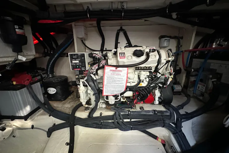 Jet Privé Yacht Photos Pics Engine compartment of a 2021 Searay 370ob boat, showcasing mechanical components and wiring.
