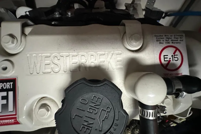 Jet Privé Yacht Photos Pics Engine compartment of 2021 Searay 370ob with Westerbeke branding and E-15 fuel warning.