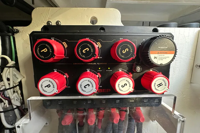 Jet Privé Yacht Photos Pics Control panel of a 2021 Searay 370ob boat with labeled red switches.