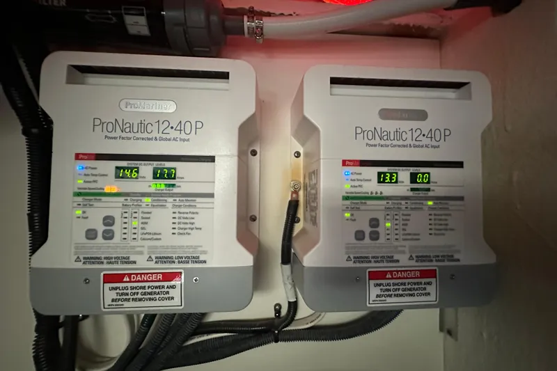 Jet Privé Yacht Photos Pics ProNautic 12:40P chargers in 2021 Searay 370ob boat, displaying voltage and current levels.