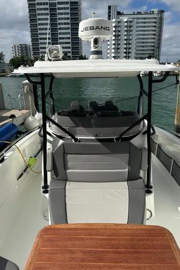 Jebang Yacht Photos Pics 2023 Jeanneau Leader 9.0 CC boat docked, featuring sleek design and modern amenities.