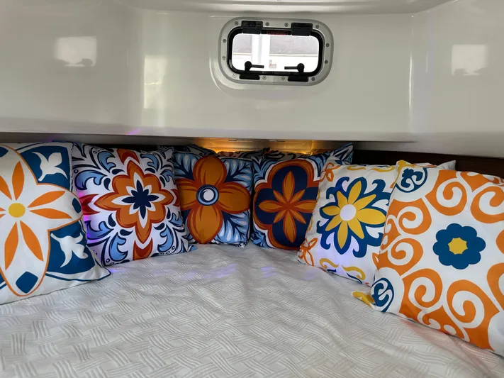 Jebang Yacht Photos Pics Colorful cushions in the cabin of a 2023 Jeanneau Leader 9.0 CC boat.