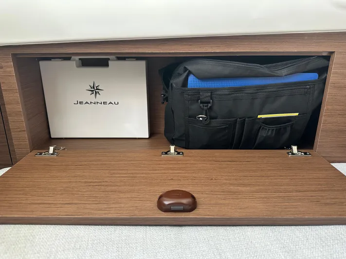 Jebang Yacht Photos Pics Storage compartment in 2023 Jeanneau Leader 9.0 CC boat with organized gear and accessories.