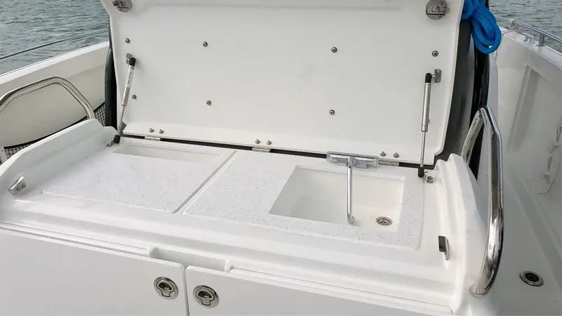 Jebang Yacht Photos Pics 2023 Jeanneau Leader 9.0 CC boat sink and storage area.