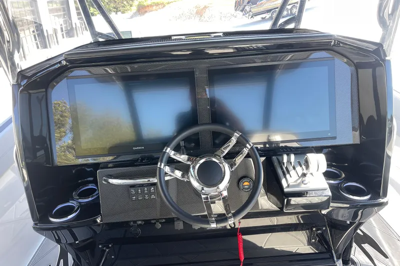  Yacht Photos Pics 2026 Nor-Tech 340 Sport Center Console dashboard with dual screens and modern controls.
