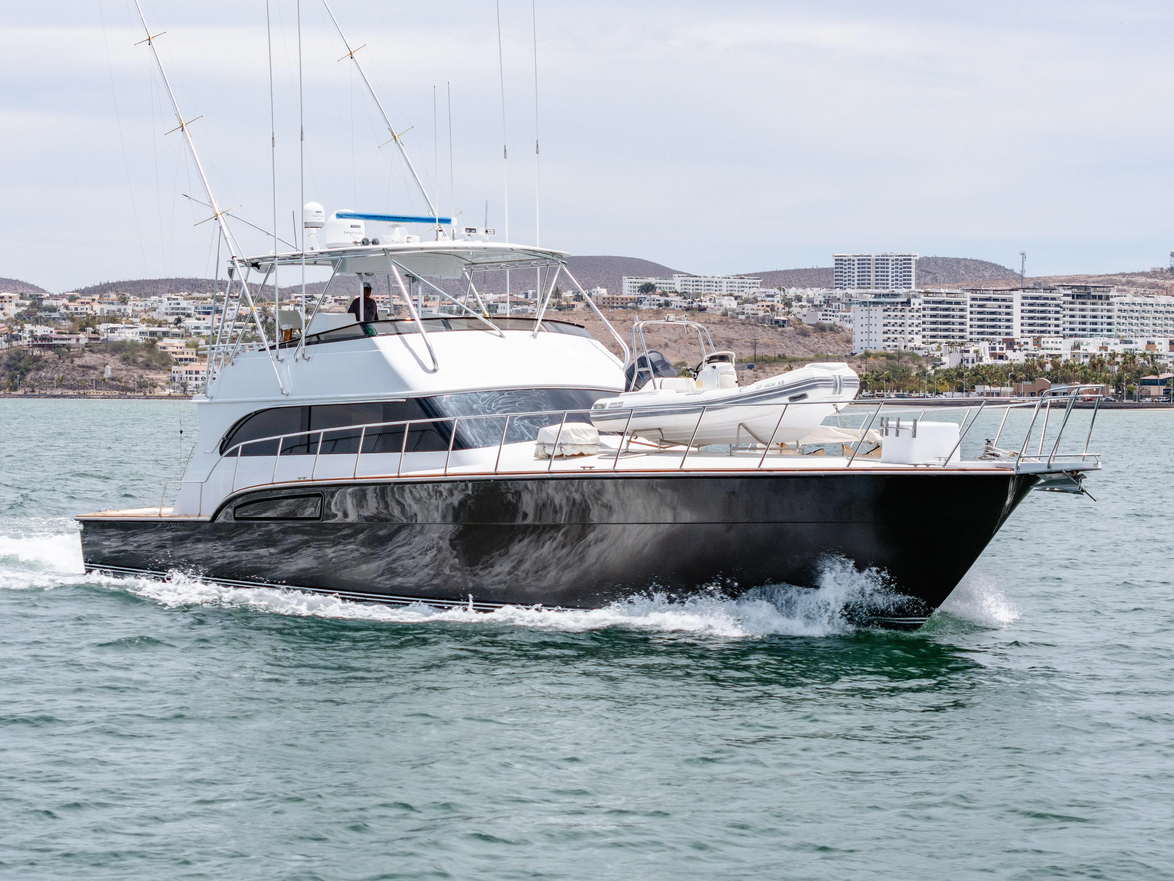 Tiger Spirit Yacht Photos Pics 1995 Donzi 72 Convertible yacht cruising on the water, showcasing sleek design and luxury.