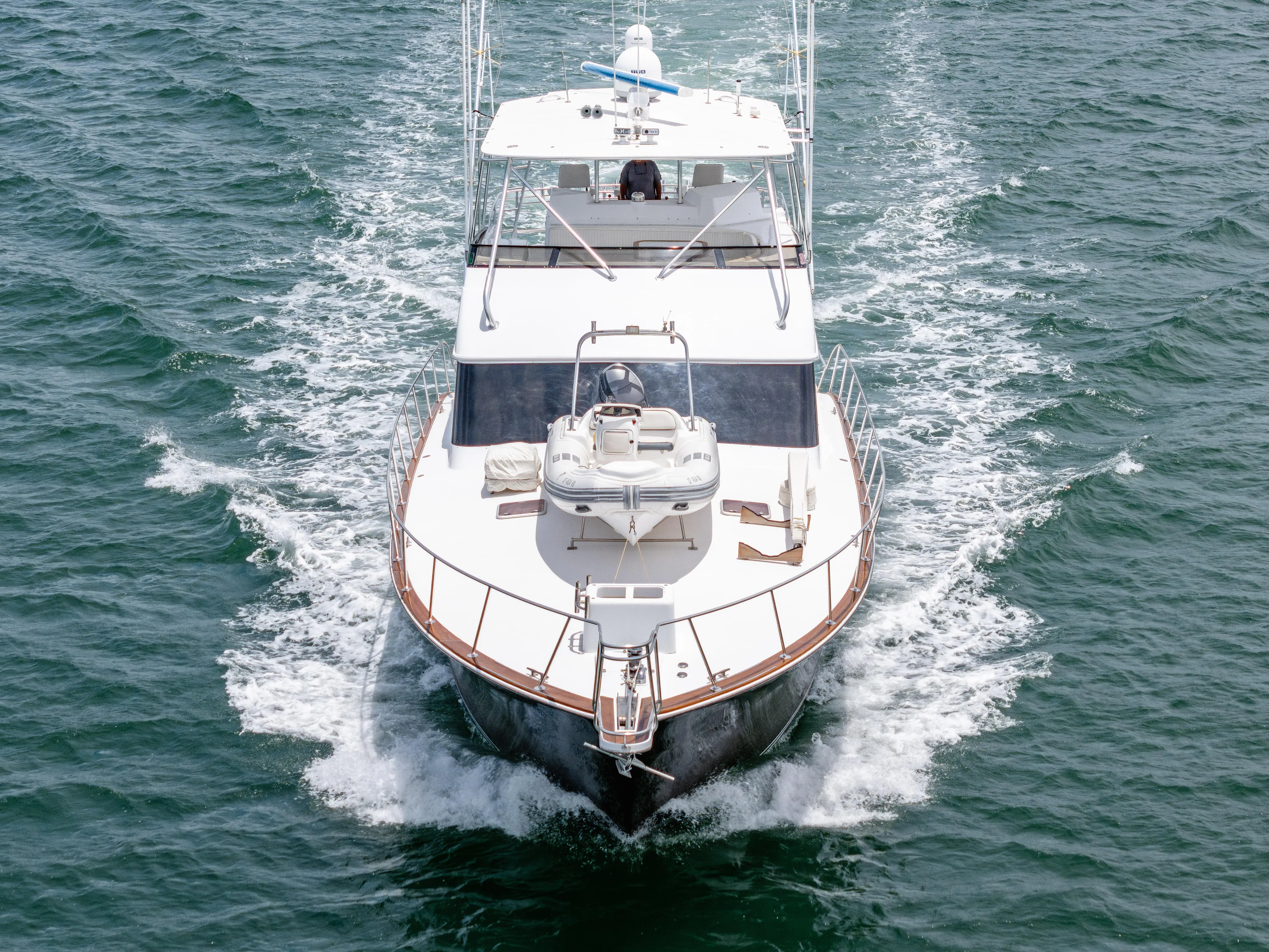 Tiger Spirit Yacht Photos Pics 1995 Donzi 72 Convertible yacht cruising on open water, aerial front view.