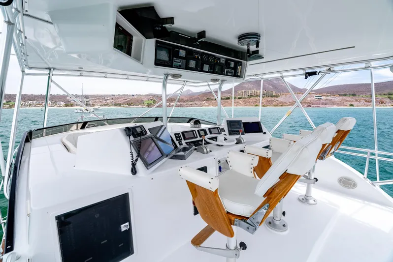 Tiger Spirit Yacht Photos Pics Cockpit of 1995 Donzi 72 Convertible yacht with modern navigation equipment and ocean view.