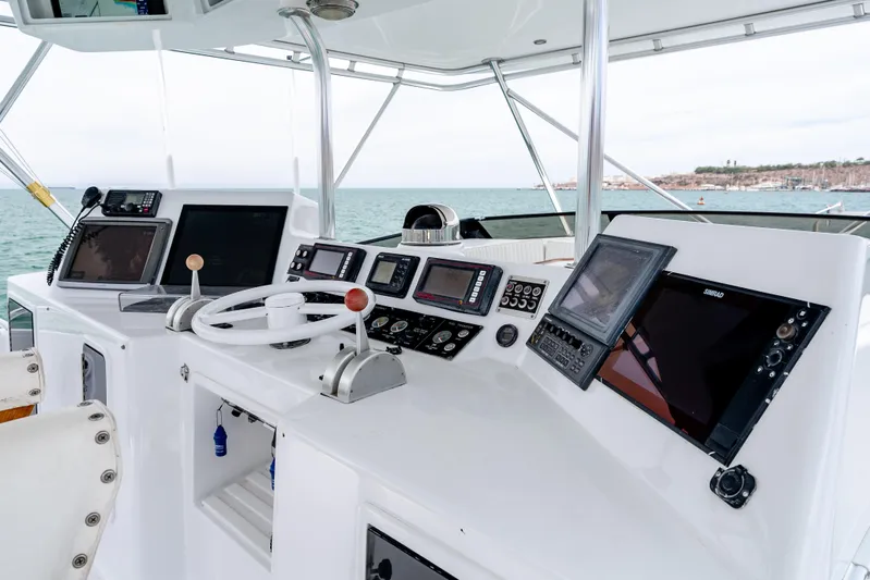 Tiger Spirit Yacht Photos Pics Cockpit of a 1995 Donzi 72 Convertible yacht with modern navigation equipment.