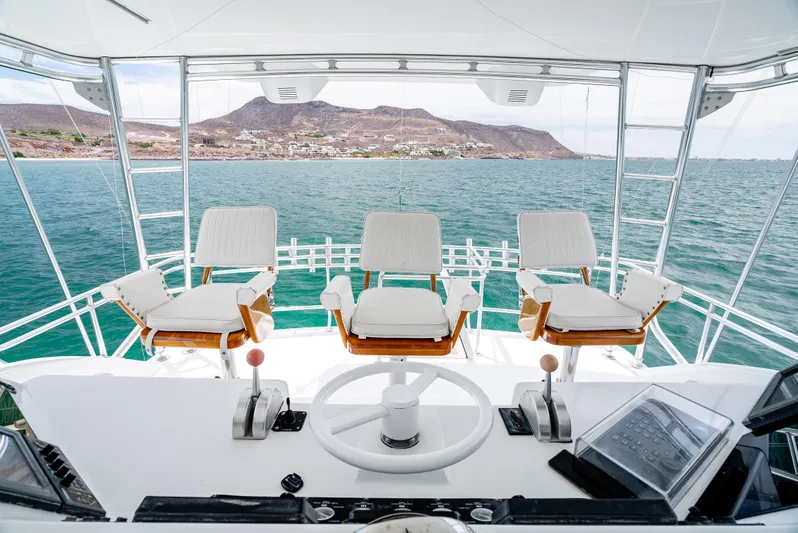 Tiger Spirit Yacht Photos Pics 1995 Donzi 72 Convertible yacht helm with ocean and mountain view.