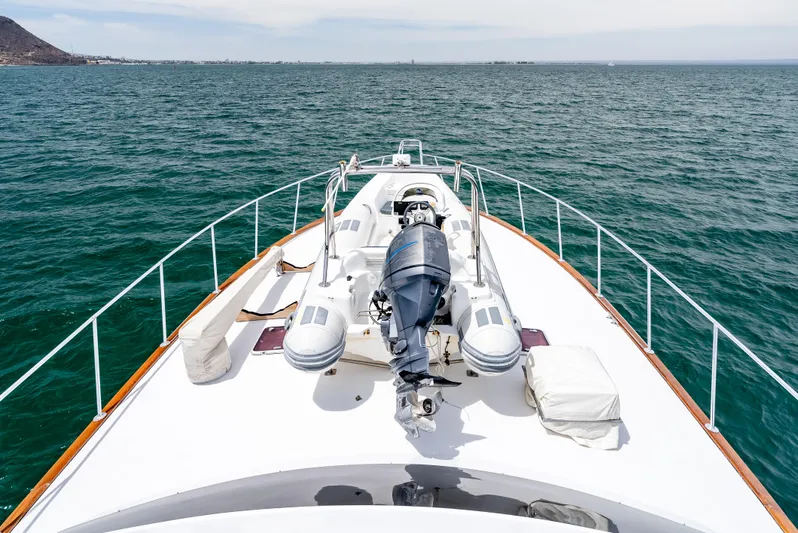 Tiger Spirit Yacht Photos Pics 1995 Donzi 72 Convertible yacht deck with inflatable boat on open sea.