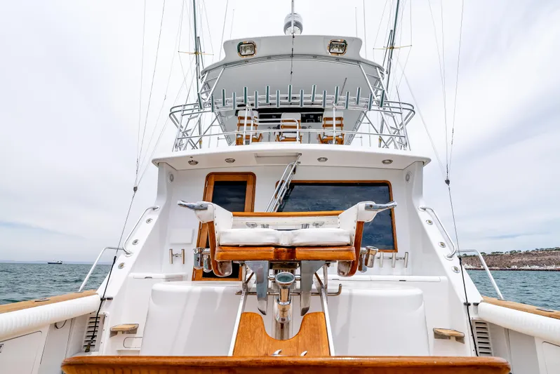 Tiger Spirit Yacht Photos Pics 1995 Donzi 72 Convertible yacht, rear view with fishing chair, ocean backdrop.