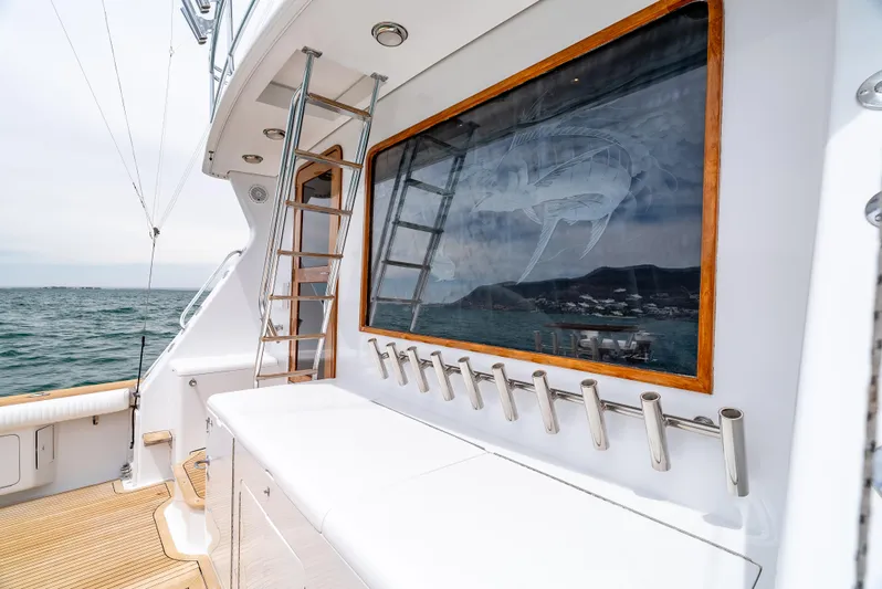 Tiger Spirit Yacht Photos Pics 1995 Donzi 72 Convertible yacht deck with fishing rod holders and ocean view.