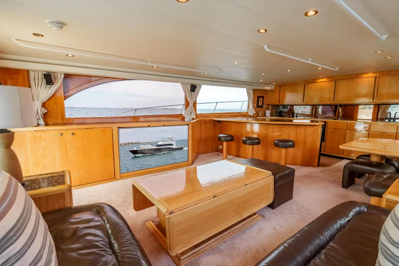 Tiger Spirit Yacht Photos Pics Luxurious interior of a 1995 Donzi 72 Convertible yacht with elegant wood finishes.