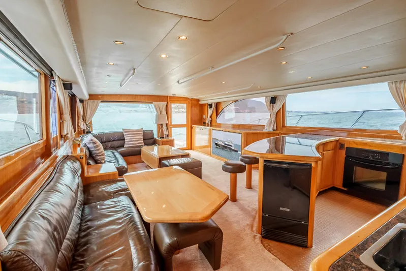 Tiger Spirit Yacht Photos Pics Luxurious interior of a 1995 Donzi 72 Convertible yacht with leather seating and ocean views.