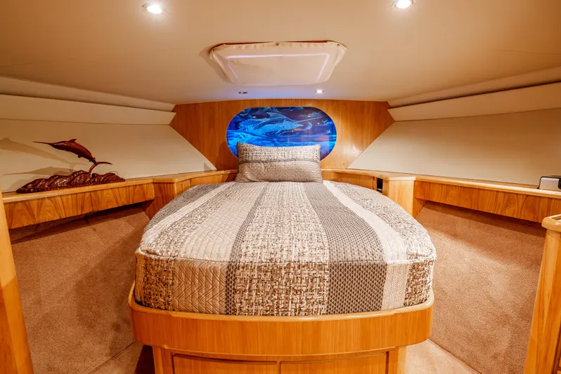 Tiger Spirit Yacht Photos Pics Luxurious cabin interior of a 1995 Donzi 72 Convertible yacht with cozy bedding.