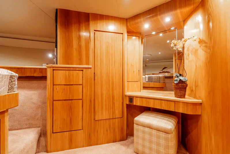 Tiger Spirit Yacht Photos Pics Luxurious wooden interior of a 1995 Donzi 72 Convertible yacht with vanity and seating.