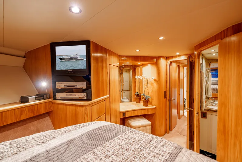 Tiger Spirit Yacht Photos Pics Luxurious interior of a 1995 Donzi 72 Convertible yacht with wood paneling and modern amenities.