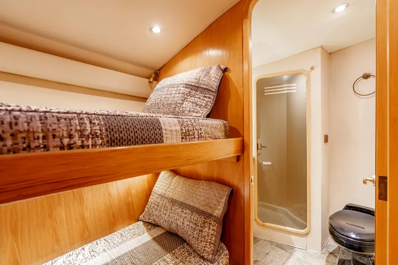 Tiger Spirit Yacht Photos Pics Interior of 1995 Donzi 72 Convertible yacht with cozy bunk beds and bathroom.