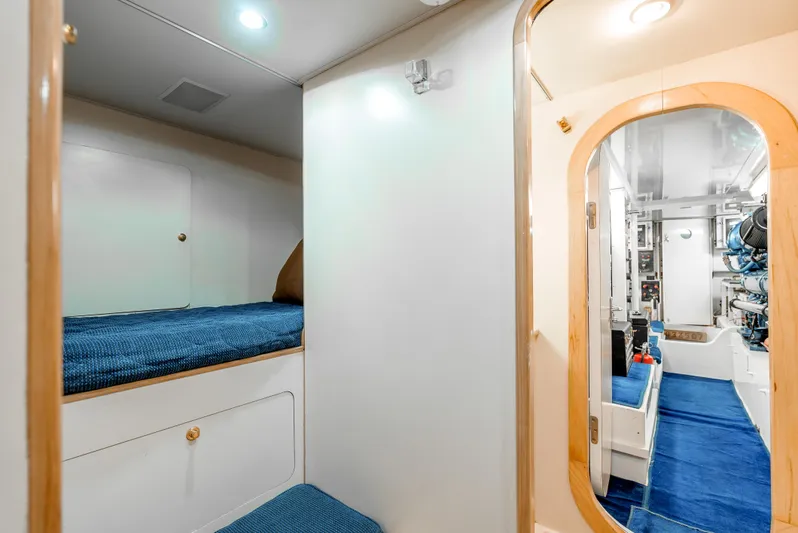 Tiger Spirit Yacht Photos Pics Interior of 1995 Donzi 72 Convertible yacht with blue carpet and wooden accents.