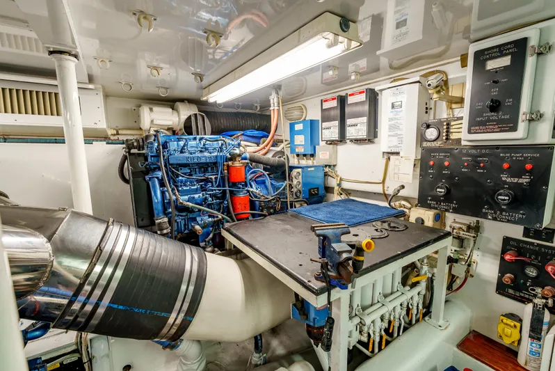 Tiger Spirit Yacht Photos Pics Engine room of a 1995 Donzi 72 Convertible yacht, featuring complex machinery and control panels.