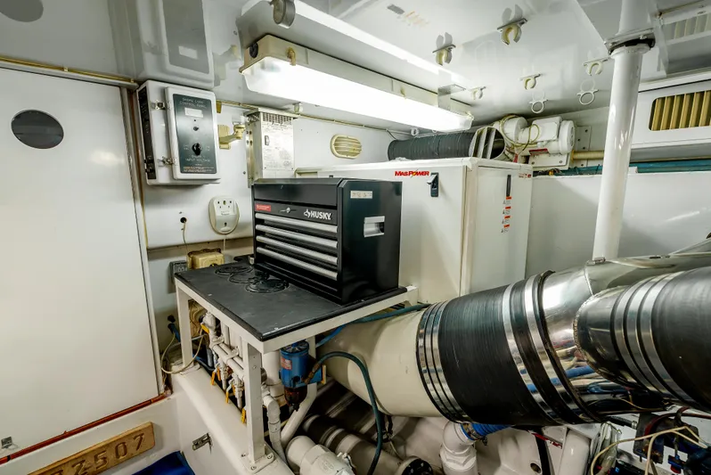 Tiger Spirit Yacht Photos Pics Engine room of 1995 Donzi 72 Convertible yacht with tool chest and mechanical equipment.