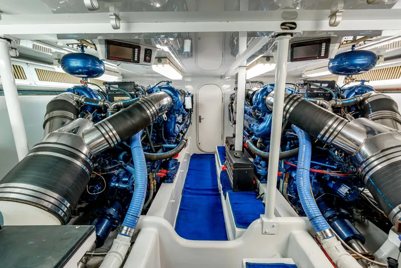 Tiger Spirit Yacht Photos Pics Engine room of a 1995 Donzi 72 Convertible yacht, featuring dual powerful engines.