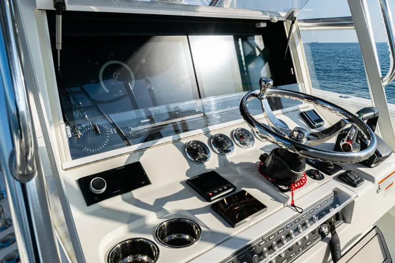  Yacht Photos Pics 2020 SeaVee 390Z boat dashboard with modern controls and steering wheel on open water.
