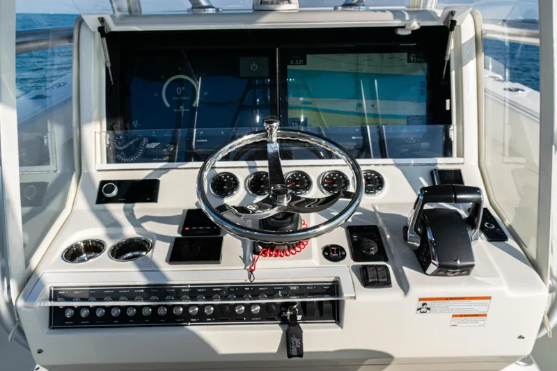  Yacht Photos Pics 2020 SeaVee 390Z boat dashboard with steering wheel and navigation controls.
