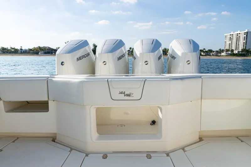  Yacht Photos Pics 2020 SeaVee 390Z boat with four Mercury engines, docked by the water.