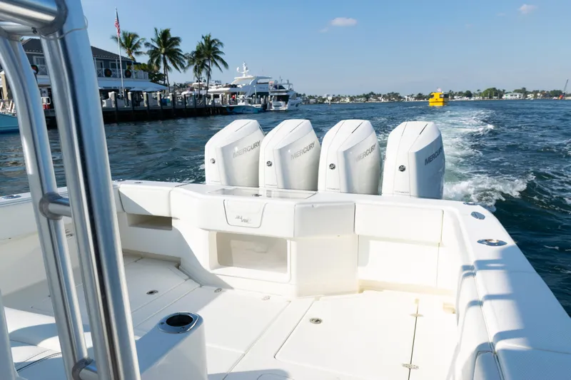  Yacht Photos Pics 2020 SeaVee 390Z boat with four Mercury engines cruising near a marina.