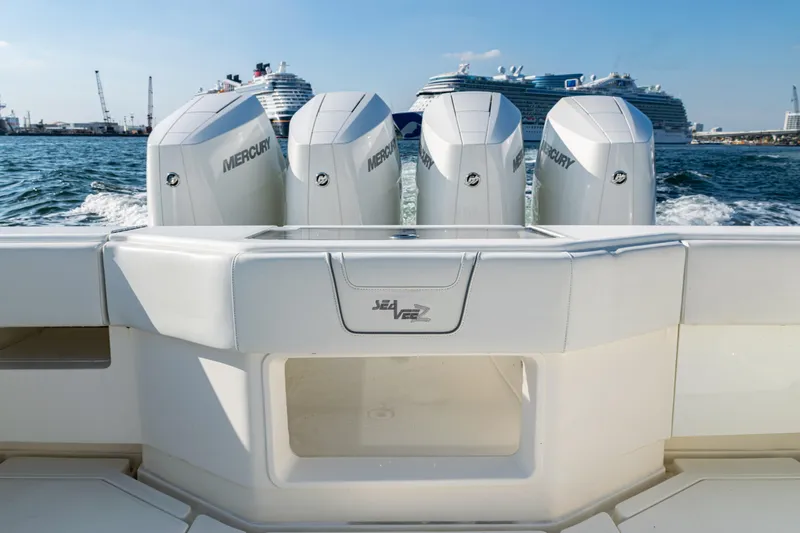  Yacht Photos Pics 2020 SeaVee 390Z boat with Mercury engines, cruising near large ships in a harbor.