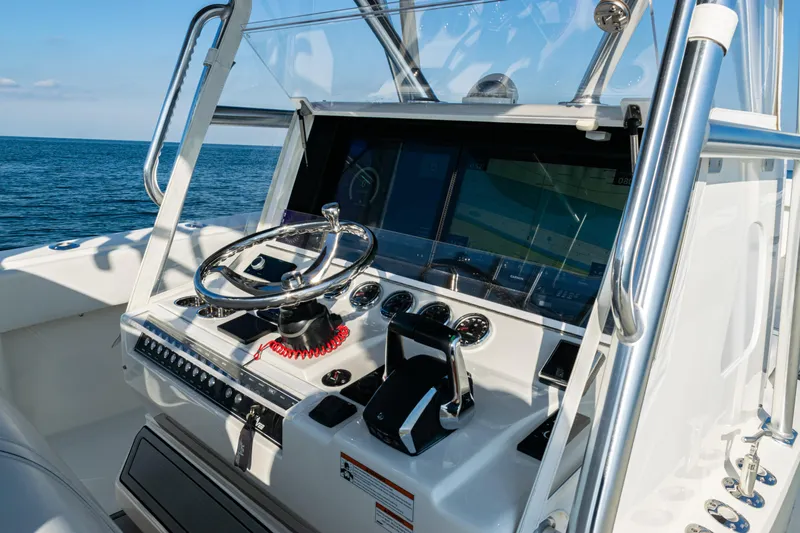  Yacht Photos Pics 2020 SeaVee 390Z boat helm with steering wheel and navigation screens.