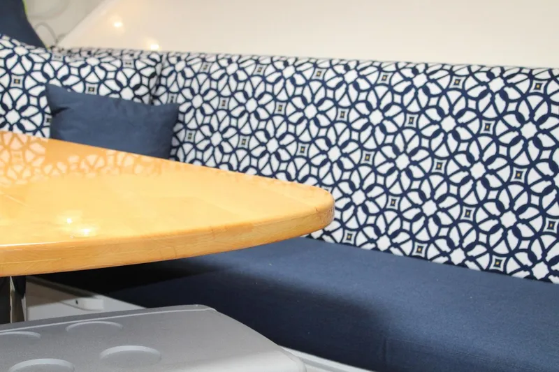 Maripal Yacht Photos Pics Interior seating area of a 2008 Contender 38 Express boat with patterned upholstery.