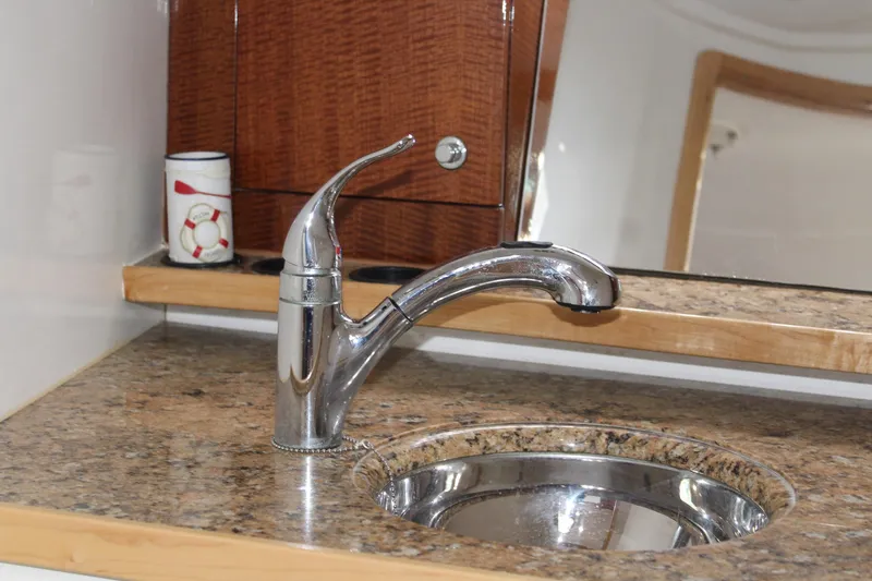 Maripal Yacht Photos Pics Contender 38 Express 2008 boat interior sink with chrome faucet and granite countertop.